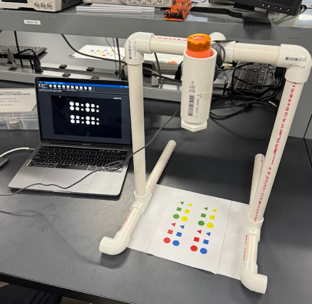 PVC camera fixture viewing colored shapes for vision testing